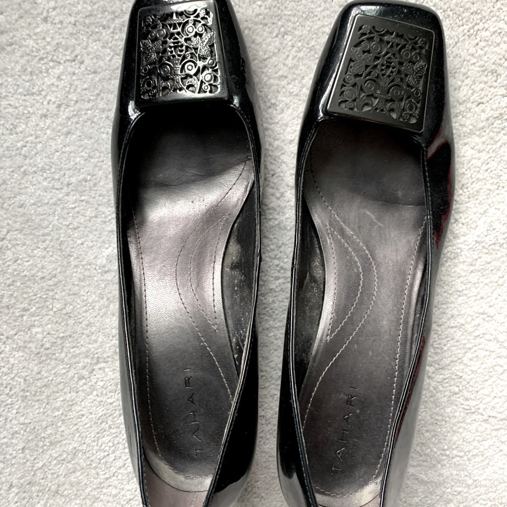 Black Tahari heels with ornate silver toe buckle